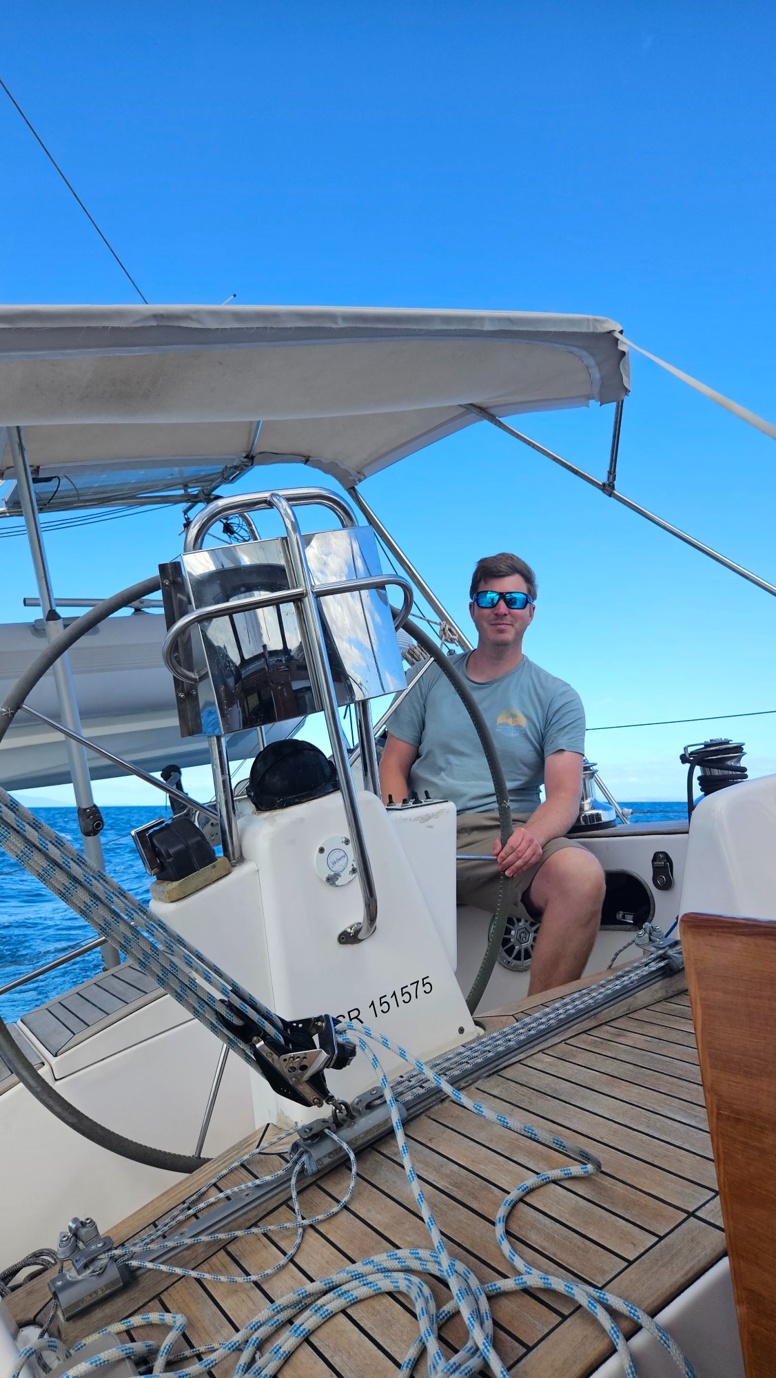 Joel Costello sailing on a clear day